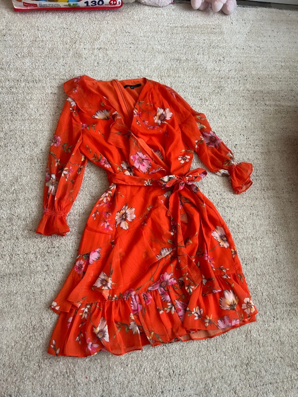 Orange mini dress with floral design